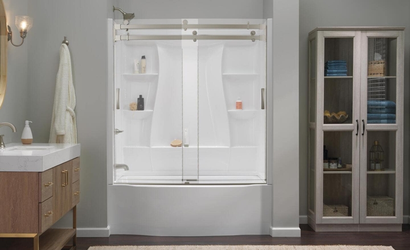 Alcove Bathtub with Integrated Shelving Surround and Sliding Glass Doors