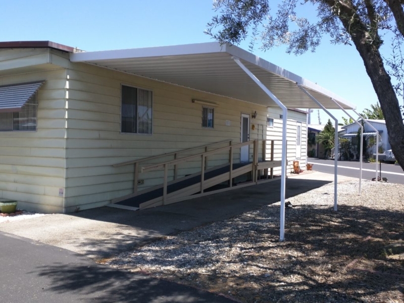 Awning Metal Sloped Roof Covering Accessible Wooden Ramp