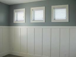 Bedroom with Three Square Windows and White Board and Batten Wainscoting