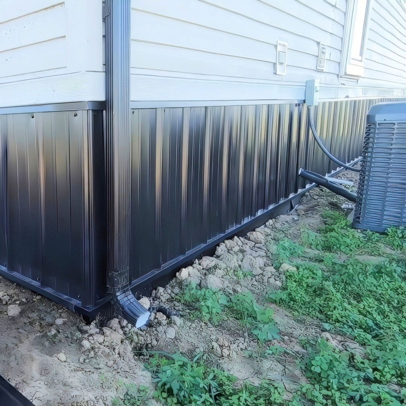 Black Corrugated Metal Skirting with Integrated Downspout