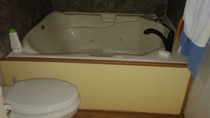Black Faucet on Almond Tub with Integrated Whirlpool Jets