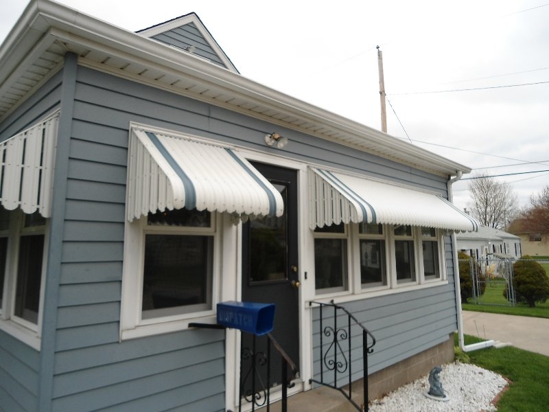 Blue and White Striped Scalloped Window Awnings