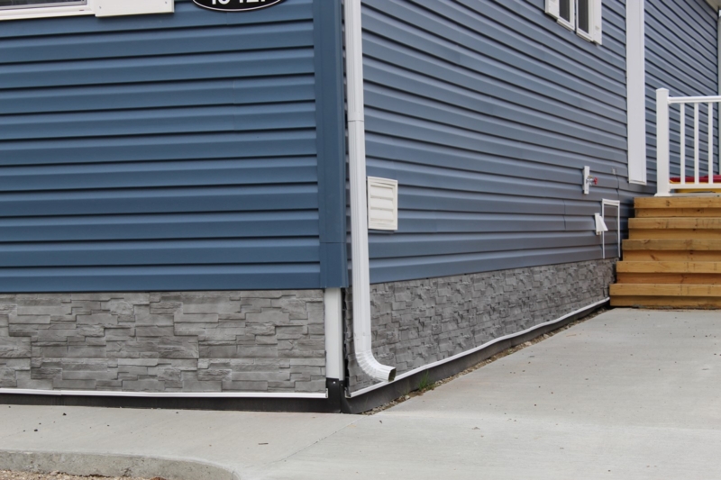 Blue Siding and Grey Stone Skirting Combination for Modern Homes