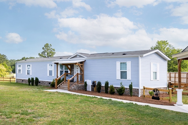 Blue Siding with White Trim Exterior and Wooden Entry Porch