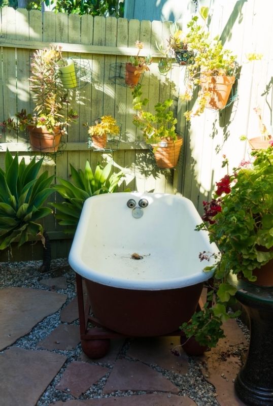 Bohemian Outdoor Spa Ideas using a Vintage Tub on Metal Stand