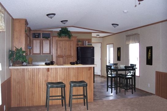 Breakfast Bar with Backless Stools and Beaded Wood Paneling