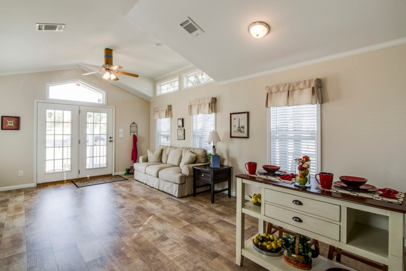 Bright Open Concept Living Room with Vaulted Ceiling and French Doors