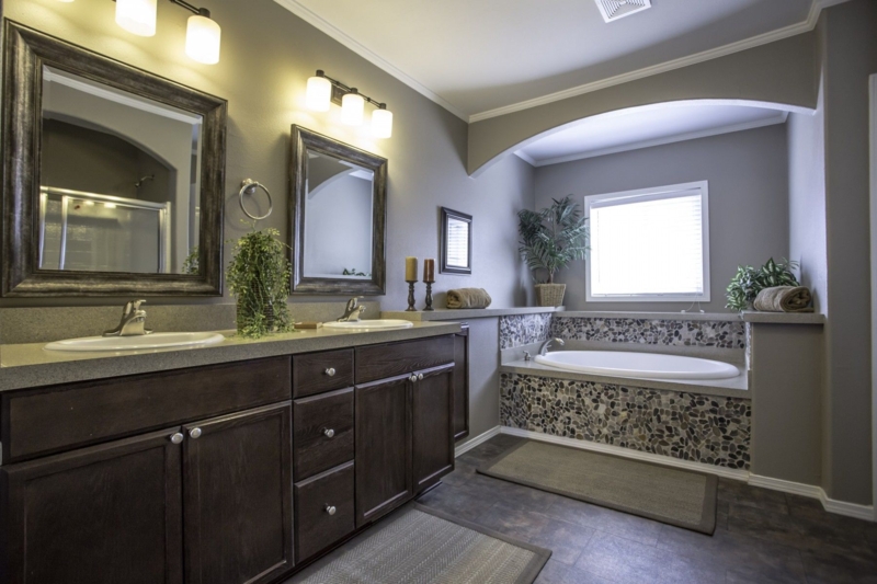Built-in Tub in Arched Alcove with Pebble Tile Surround Feature