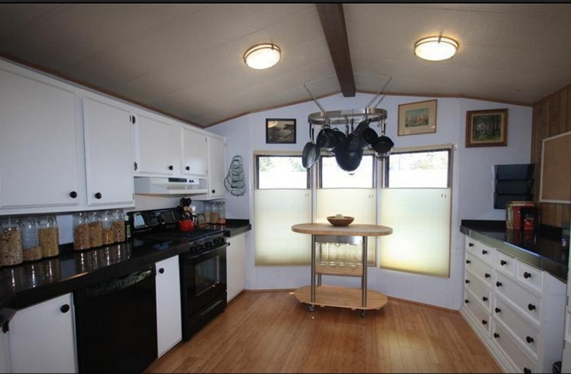 Ceiling Mounted Hanging Pot Rack in Small White Kitchen
