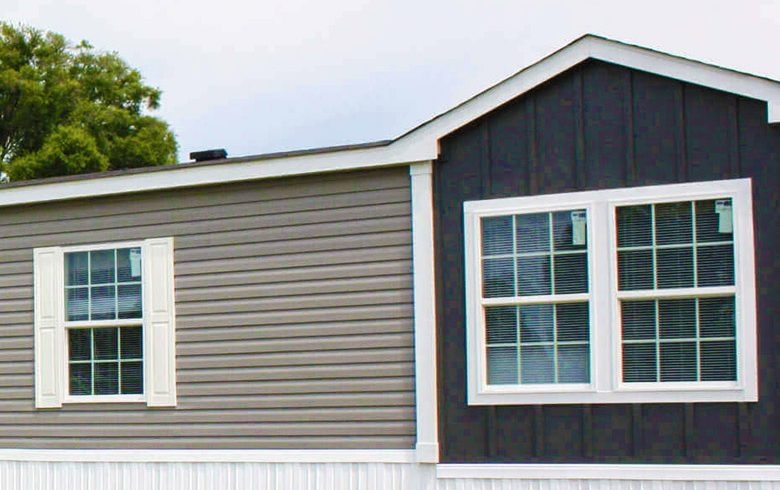 Charcoal Board and Batten Siding with White Shutters and Dual Styles
