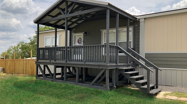 Charcoal Gray Covered Porch with Gabled Roof Truss and Stairs