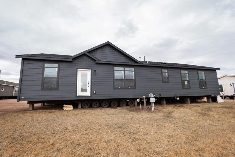 Charcoal Manufactured Home: Gabled Entrance with White Front Door