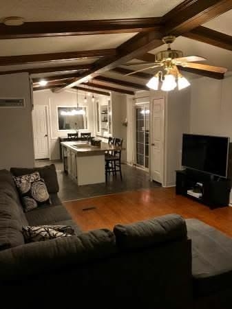 Charcoal Sectional Sofa Living Room Design with Dark Wood Beams