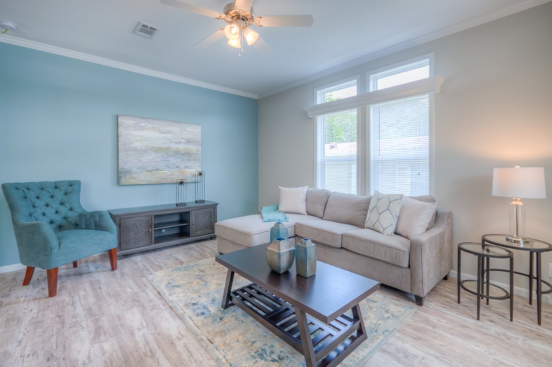 Coastal Blue Living Room Colors with Teal Tufted Accent Chair Styling