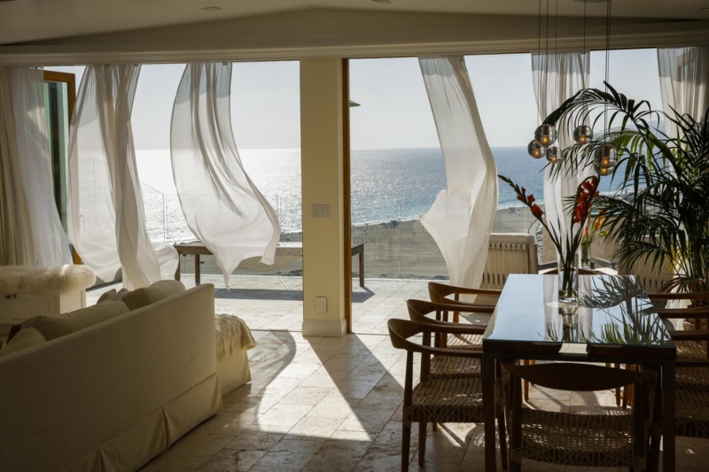 Coastal Dining Room with Billowing White Sheer Curtains