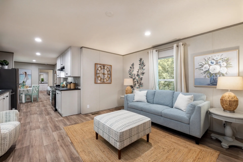 Coastal Inspired Mobile Home Decor with Light Blue Sofa and Jute Rug