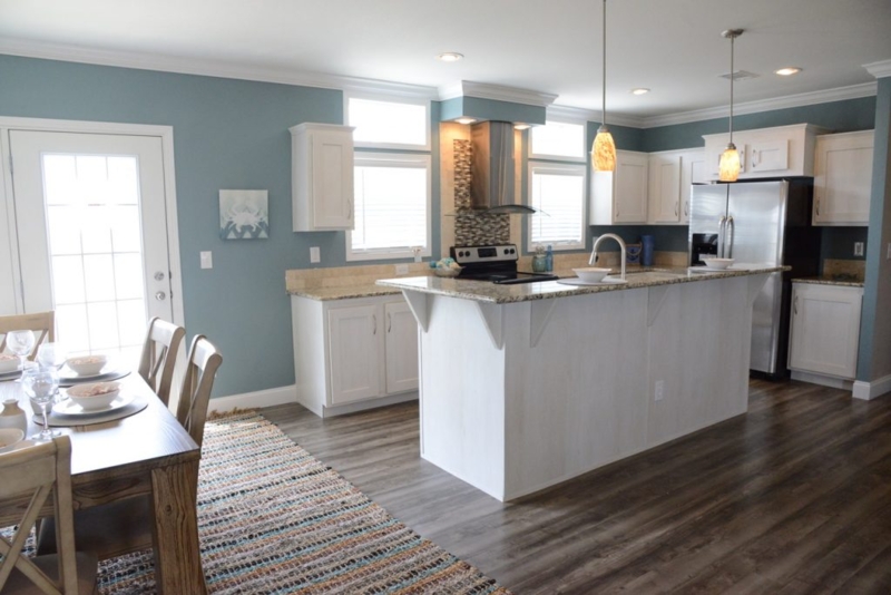 Coastal Kitchen with Blue Walls and Multi Colored Striped Dining Rug