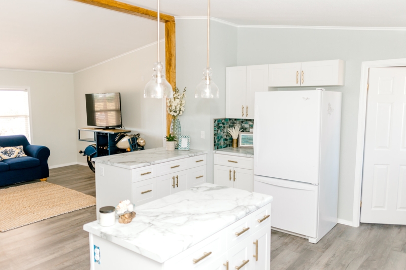 Coastal Kitchen with Teal Backsplash and Gold Hardware