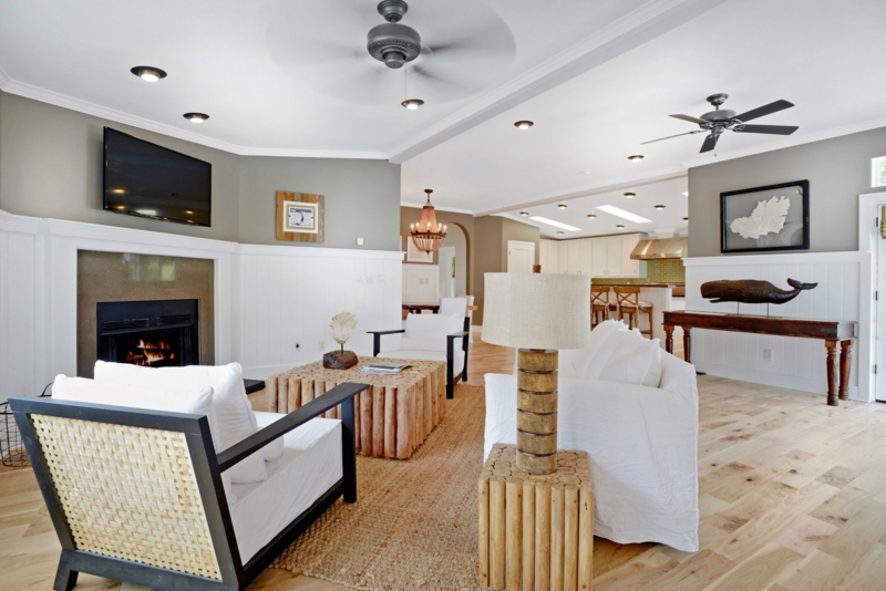 Coastal Living Room with White Wainscoting and Built-in Fireplace