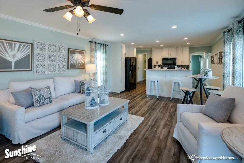 Coastal Open Concept: Light Blue Walls & Whitewashed Wood