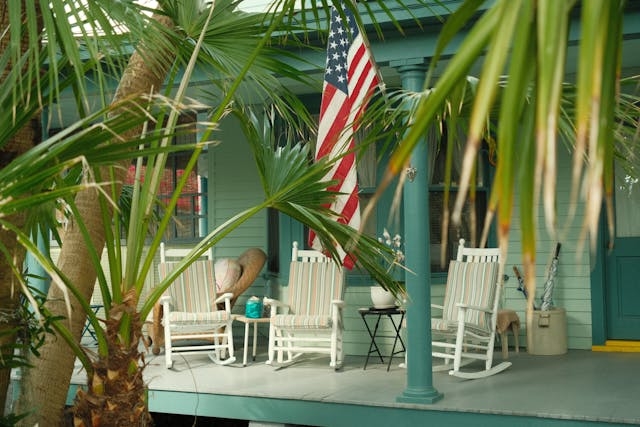 Coastal Porch with White Rocking Chairs and Striped Cushions