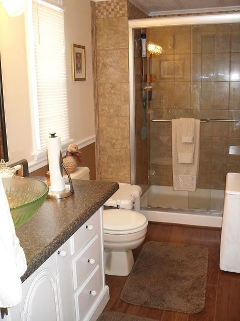 Compact Bathroom: Green Glass Vessel Sink and Tiled Walk-In Shower