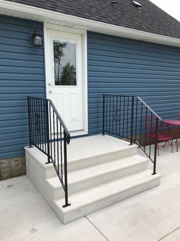 Concrete Steps with Ornamental Metal Railings for Precast Patio Entry.