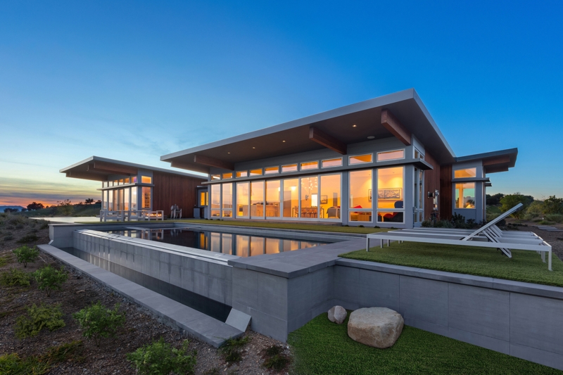 Contemporary Home Exterior: Infinity Edge Pool, Cantilevered Roof