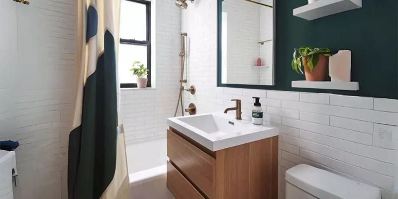 Contemporary Wood Vanity, Gold Hardware, and Dark Green Accent Wall