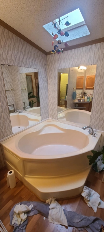 Corner Garden Tub Design Ideas with Skylight and Dual Mirrors