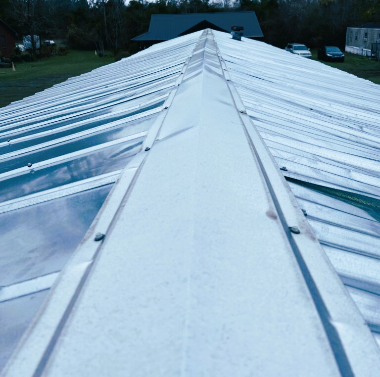 Corrugated Metal Roof with Ridge Cap and Exposed Fasteners