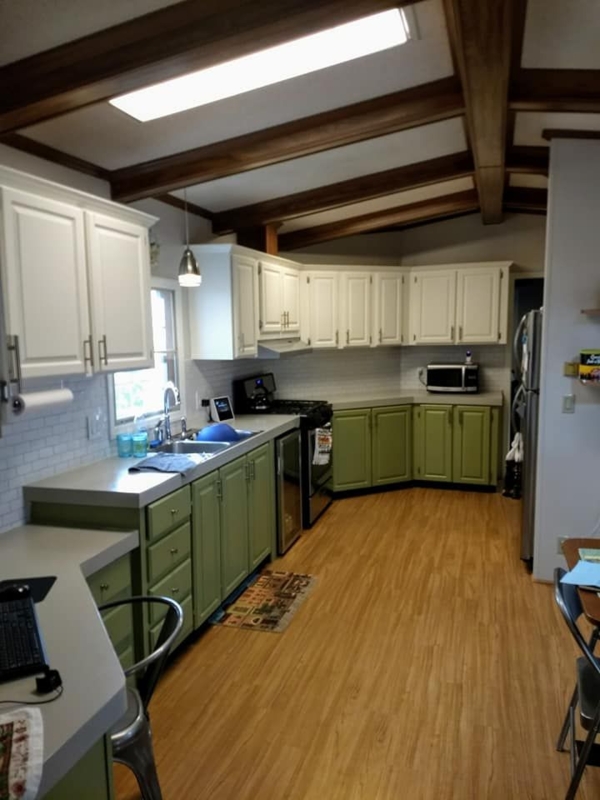 Cottage Kitchen with Exposed Dark Beams & Sage Green Two-Tone Cabinetry