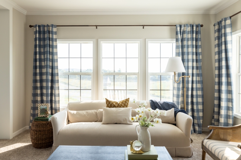 Cottage Living Room Blue Gingham Curtains and Cream Skirted Sofa