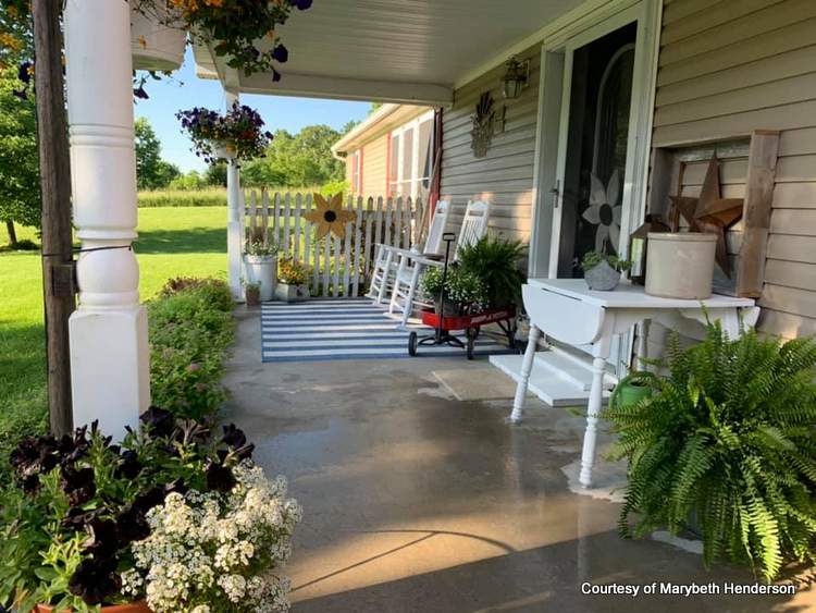 Cottage Porch with White Rocking Chairs & Striped Rug
