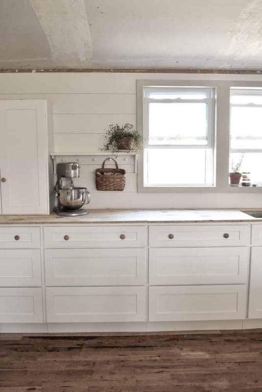 Cottage Style Kitchen Shiplap Walls and Light Wood Countertops