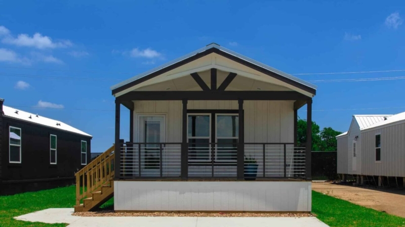 Covered Front Porch with Horizontal Metal Railing and Dark Trim
