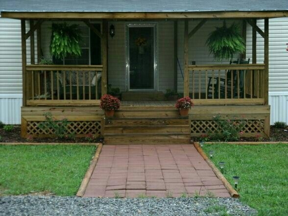 Covered Porch with Lattice Skirting & Brick Paver Walkway