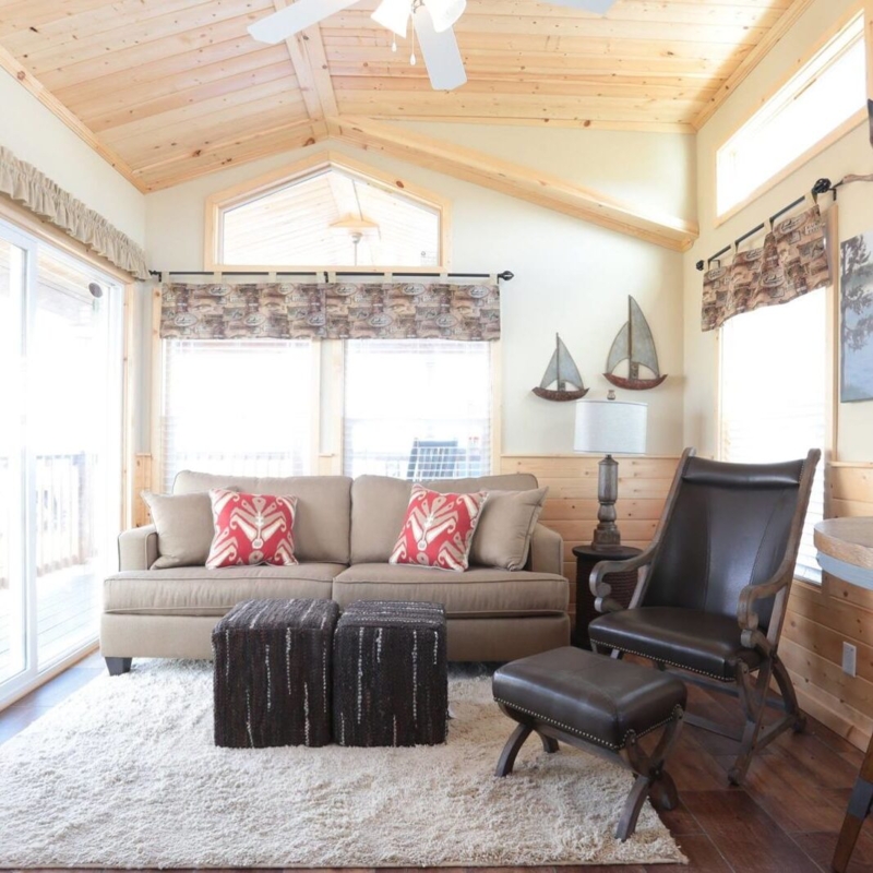 Cozy Cabin Living Room with Rustic Wood Plank Ceiling and Shag Rug
