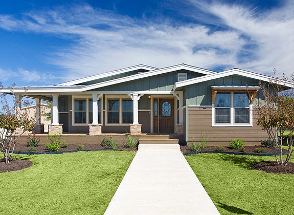 Craftsman Manufactured Home Exterior with Two-Tone Siding and Stone Columns