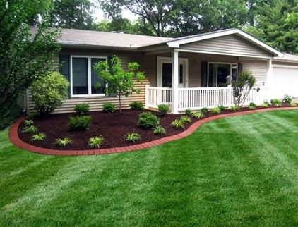 Curved Brick Landscape Edging in Residential Front Yard with Striped Lawn
