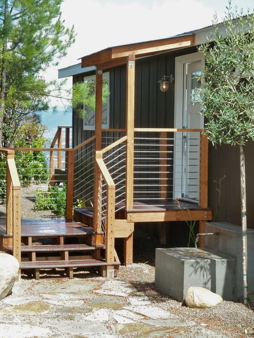 Dark Siding Exterior with Cable Railing Porch Design