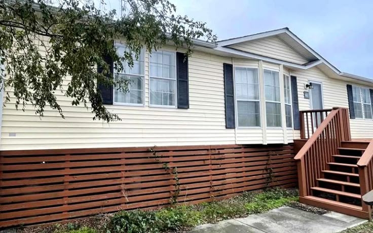 Dark Wood Horizontal Slat Skirting with Matching Exterior Stairs