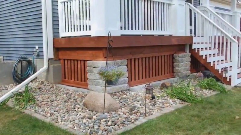 Deck Skirting Ideas: Wood Slats with Stone Pillars & River Rocks