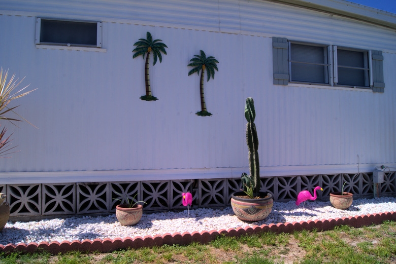 Decorative Concrete Block Foundation Cover with Tropical Yard Decor