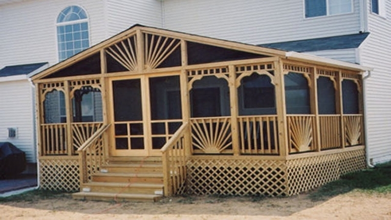 Decorative Wooden Screened Porch with Sunburst Motif and Lattice Base