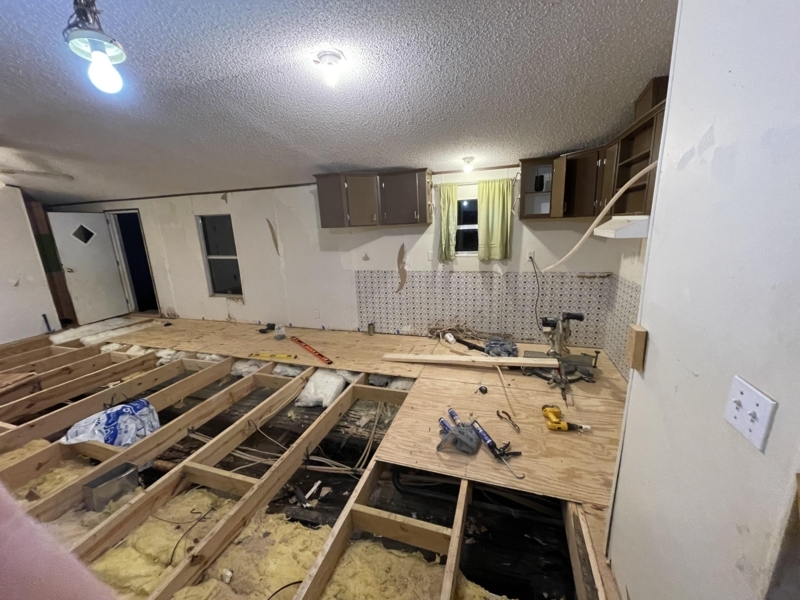 DIY Subfloor Installation Project showing Exposed Floor Structure