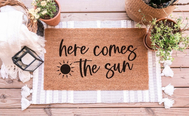 Doormat Sun Motif With Cursive Typography And Layered Rug Look For Porch