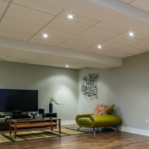 Drop Ceiling System with Recessed Lighting in Modern Basement Lounge