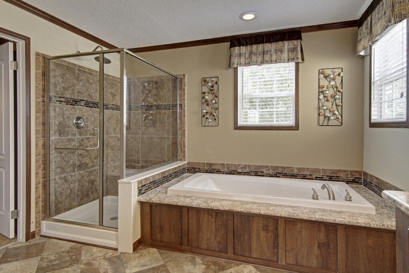 Drop-In Bathtub with Wood Look Surround and Glass Shower Enclosure