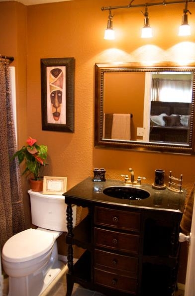 Eclectic Bathroom with Global Decor and Burnt Orange Walls